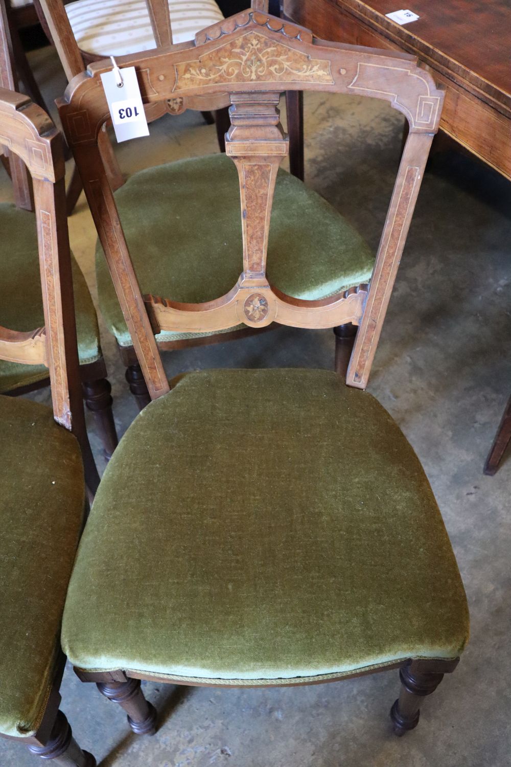 A set of four Victorian inlaid walnut dining chairs